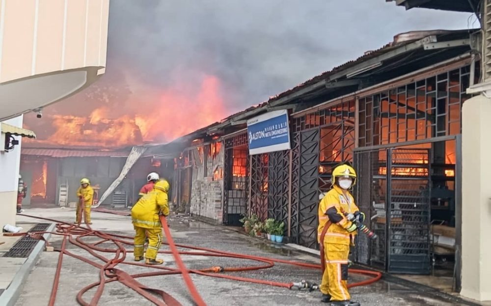 Firefighters Brave Danger to Contain George Town Factory Fire