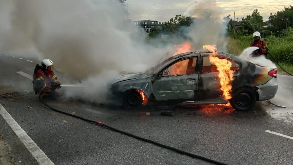 Husband and Wife Injured as Car Skids and Catches Fire in Miri